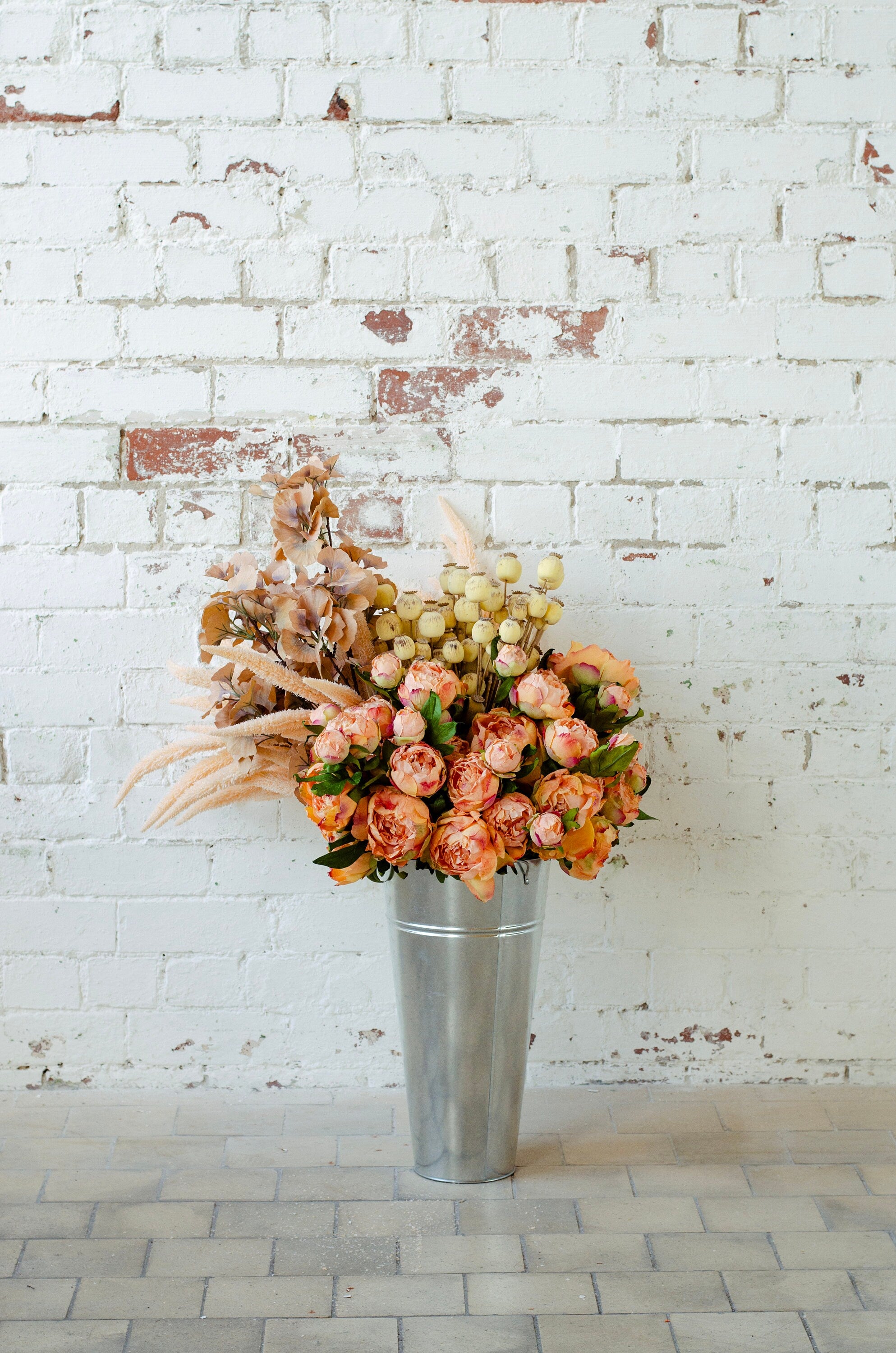 Faux dry look poppy seed pod spray with 70cm tall, single stem