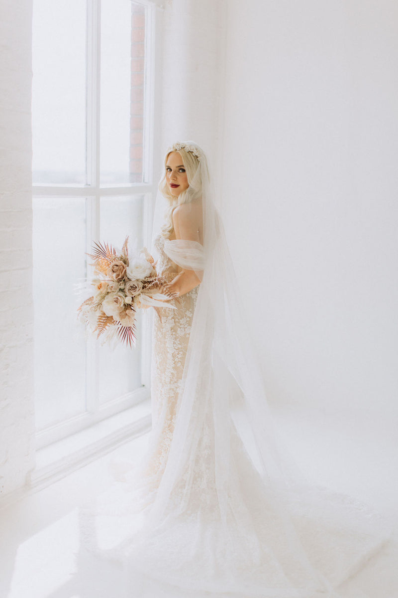 Model Bethany wearing Forever Bridal Dress and Innocent Chaos  Drew Faux Bridal bouquet 